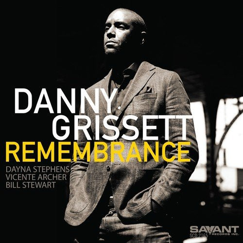 "Danny Grissett album cover with a man in a suit, black background, and text."