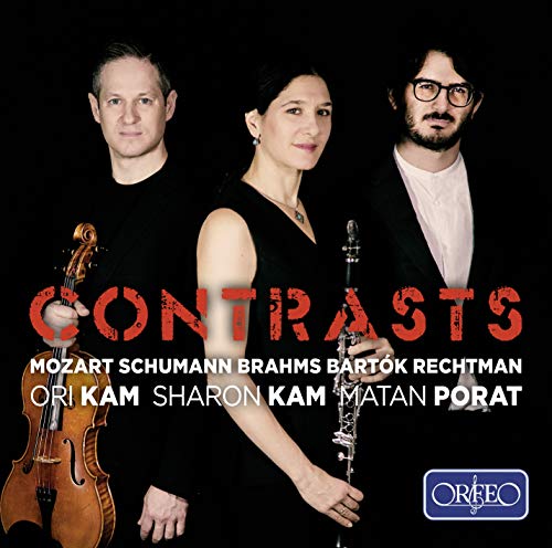 "CD cover featuring three musicians with instruments against a black background."
