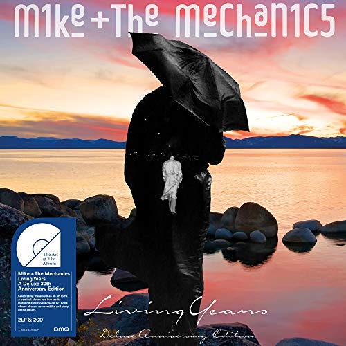 "Album cover with man holding umbrella, standing on rocks by calm water at sunset."