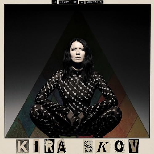 Album cover for Kira Skov’s “My Heart Is A Mountain” featuring a crouching woman.