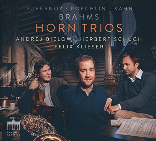 "CD cover featuring three men with musical instruments in an ornate room."