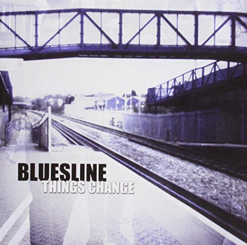 "Album cover featuring a faded, black-and-white photo of train tracks under a bridge."