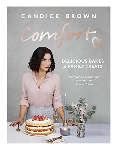 "Book cover featuring a woman beside a table with a cake and flowers."