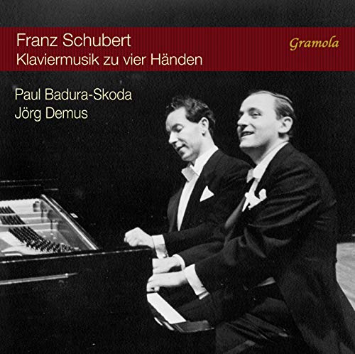 Black and white image of two men playing piano together on a CD cover.