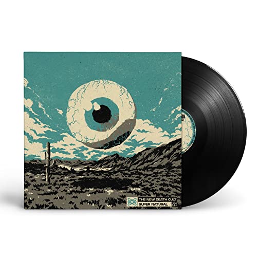 Vinyl record with cover art featuring a large eye over a desert landscape.
