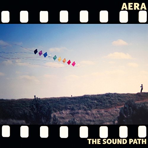 Vinyl record cover: colorful kites flying over a desert landscape.