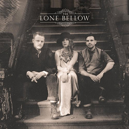 "Black and white album cover featuring three people sitting on a staircase."