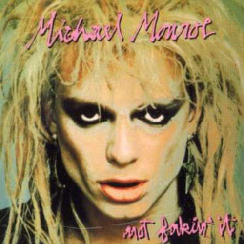 "CD cover with a close-up of a person with blonde hair and dark eye makeup."