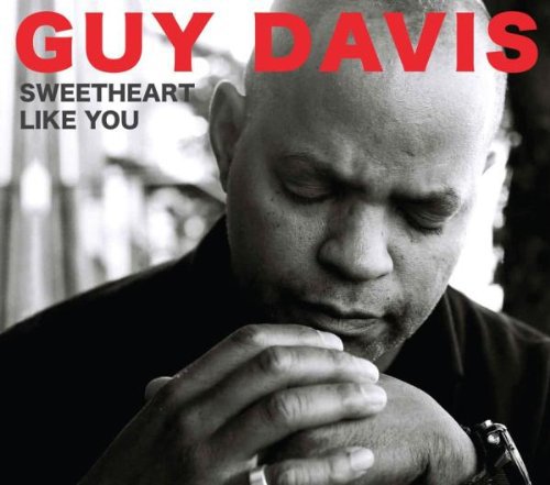 "Album cover featuring a black-and-white photo of Guy Davis with clasped hands."