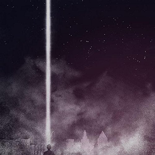 Dark cityscape with a bright vertical light beam and starry sky.