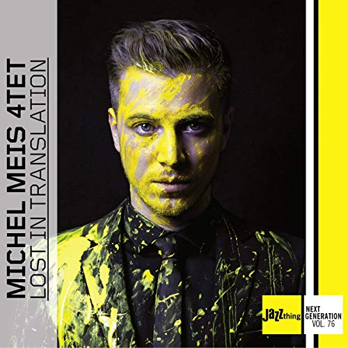 "Album cover featuring a man with yellow paint splatters on a black background."