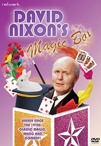 David Nixon, a magician, with a rabbit, cards, and a top hat.