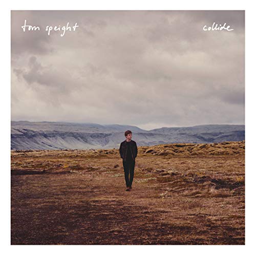 Album cover with a man walking in a barren landscape under a cloudy sky.