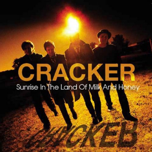 "Album cover with four men walking towards the camera, lit by a bright light."