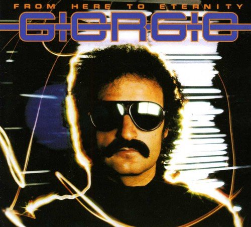 "Album cover featuring a man with sunglasses and mustache, surrounded by abstract light effects."