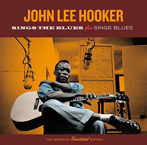 John Lee Hooker album cover featuring him with a guitar and microphones.