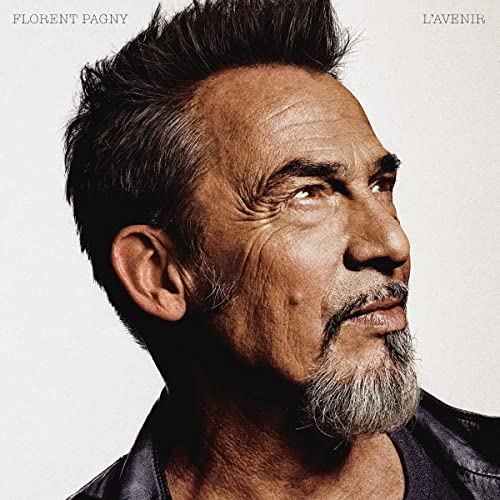 Close-up portrait of Florent Pagny, a man with short, spiked hair.
