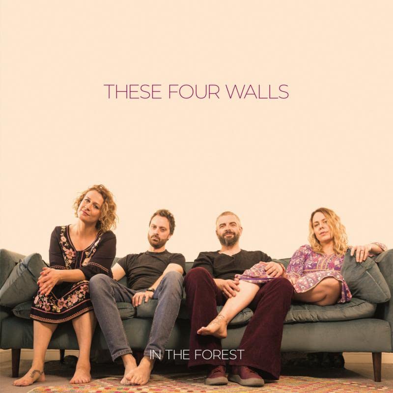 Album cover featuring four people sitting on a grey sofa.