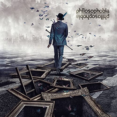 CD cover: man in suit walking on broken picture frames.