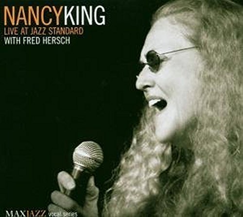 "CD cover featuring a black-and-white photo of a woman singing into a microphone."