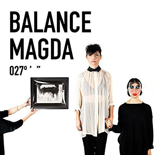 "Album cover with man and woman holding hands, and a framed image being held."