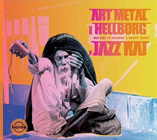 Album cover: man in robes holding phone, with colorful background and text overlay.
