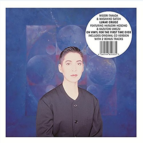 "Vinyl record cover featuring a man in a dark shirt against a blue background."