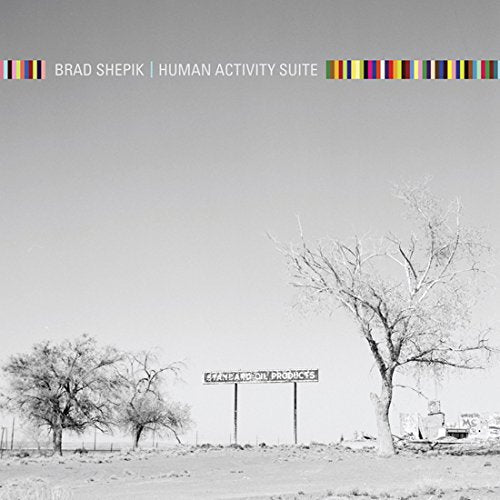 "Album cover with a black and white landscape photo and multicolored border at top."