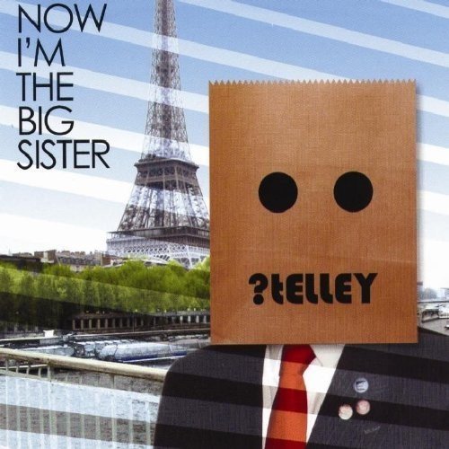 "Telley album cover: person in suit with paper bag over head, Eiffel Tower in background."
