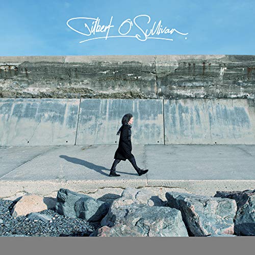 Vinyl record cover featuring a person walking alone on a concrete surface.