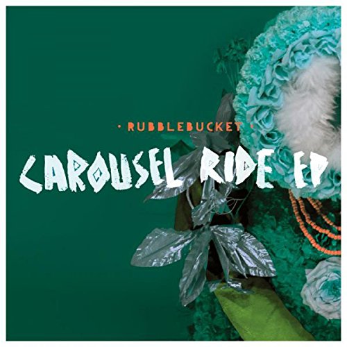 The image shows a green album cover with flowers and text. For accessibility purposes, a suitable alt text could be: "Green album cover with flowers and 'Rubblebucket Carousel Ride EP' text."