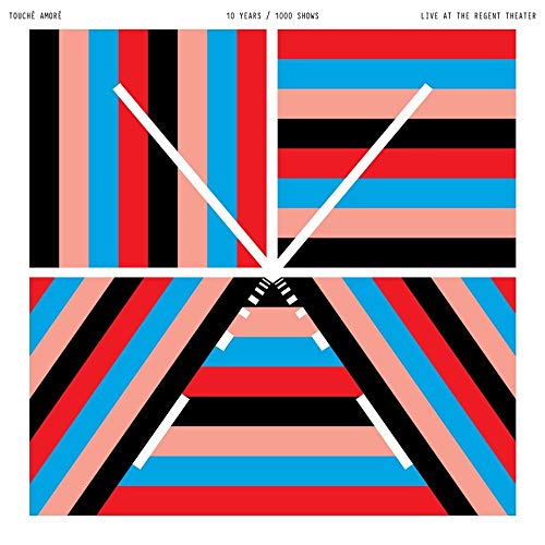 A vinyl record sleeve with a colorful striped pattern and white clock hands.