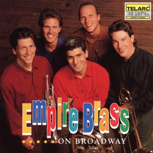 The image shows a CD cover featuring five men holding brass instruments. The title "Empire Brass on Broadway" is prominently displayed in colorful letters at the bottom, with the subtitle "...on Broadway" written below it. The men are dressed in dark-colored shirts and are positioned in front of a wooden background. A logo in the top-right corner reads "TELARC DIGITAL". Alt text: "CD cover featuring five men holding brass instruments, titled 'Empire Brass on Broadway'."