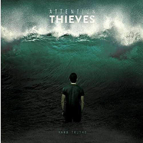 A man stands in dark water, facing a massive wave, on an album cover.
