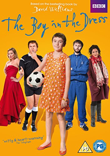 Five people stand against a yellow background, including a boy wearing an orange dress.