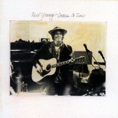 "Neil Young album cover with black and white photo of him playing guitar."
