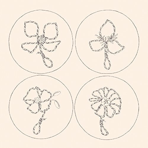 The image depicts a beige background with four circular illustrations of flowers. For accessibility purposes, a suitable alt text could be: "Four black flower illustrations in circles on a beige background."