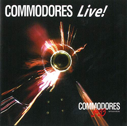 CD cover for "Commodores Live!" featuring a blurred trombone and flames.
