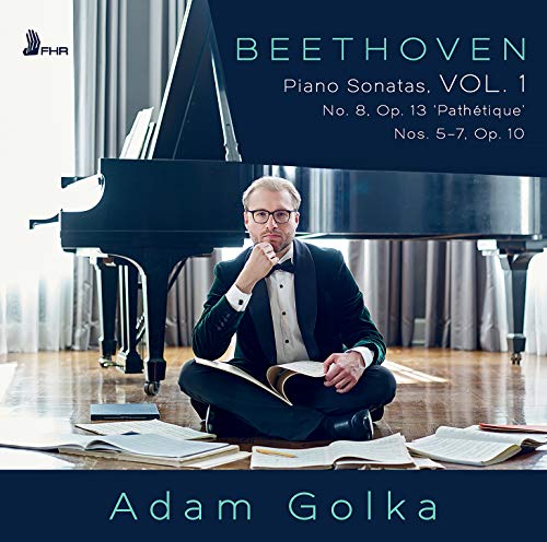 CD cover featuring a man in a tuxedo sitting by a grand piano.