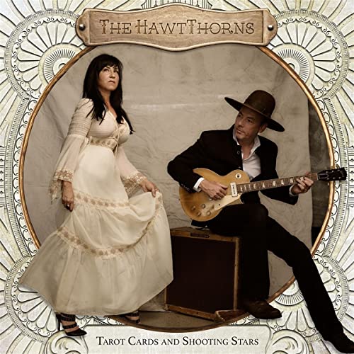 CD cover featuring two musicians with a guitar, framed by ornate design.