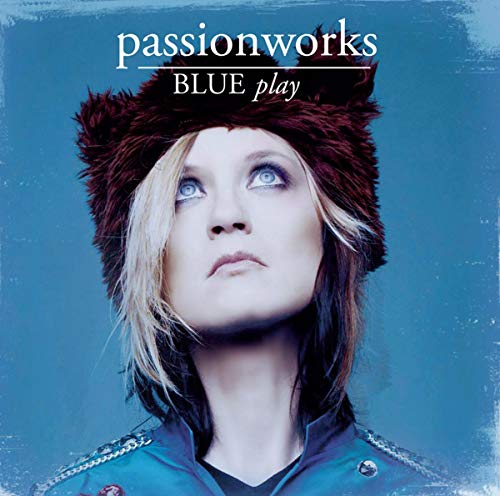 CD cover: woman in a furry hat looking upwards, blue background.