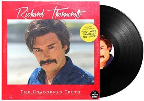 Vinyl record sleeve with a man's portrait and a black vinyl record.