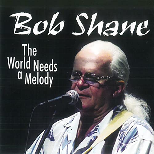 Bob Shane portrait with microphone, album cover for "The World Needs A Melody".