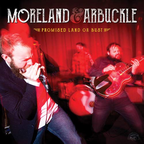 "CD cover featuring three men performing music, with red-toned image and text."