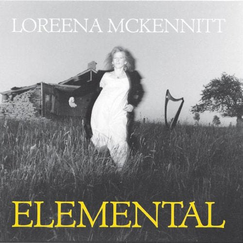 "Loreena McKennitt's Elemental album cover featuring a woman in a white dress in a field."