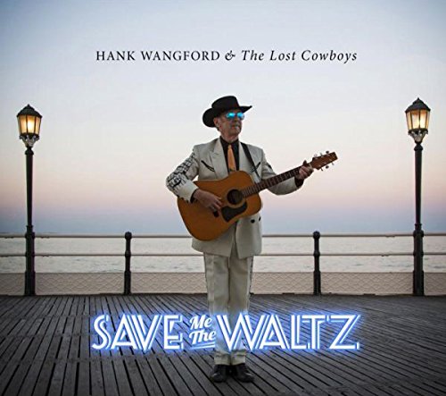 Album cover with man in white suit holding guitar on a pier.