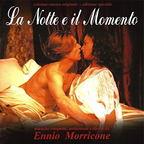 "Album cover with two women in bed, blue background, and white text."