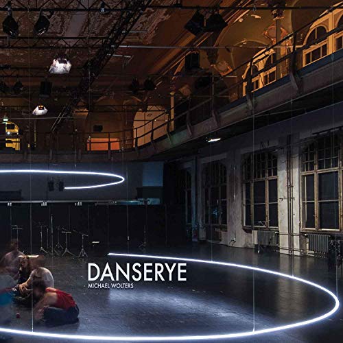 "CD cover with dancers in a studio surrounded by glowing neon circle."