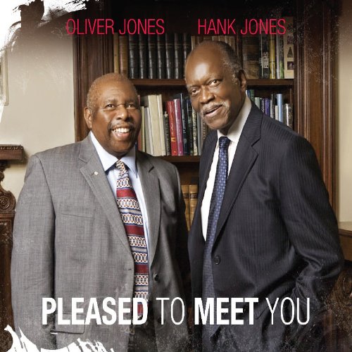 "Album cover with two men in suits standing in front of a bookshelf."