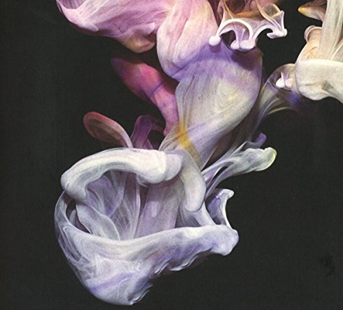 Abstract swirls of pink and white paint against a dark background.